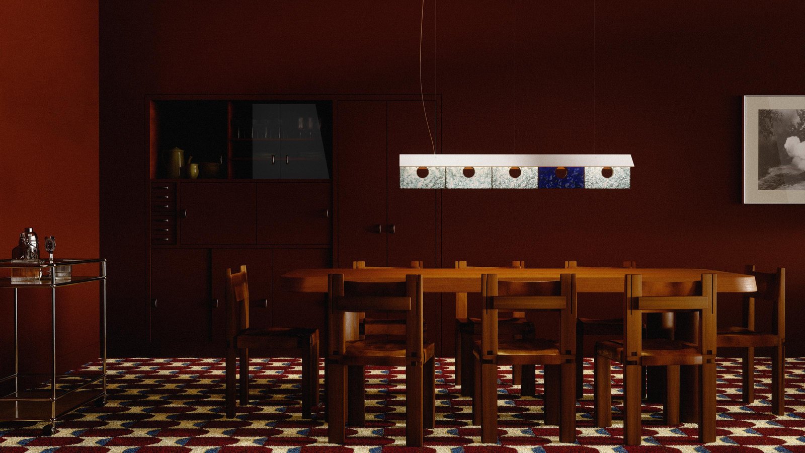 Lambert & Fils Bolda suspension lamp over a vintage wooden dining table with Pierre Chapo chairs. Vintage 60's carpet, moody lighting