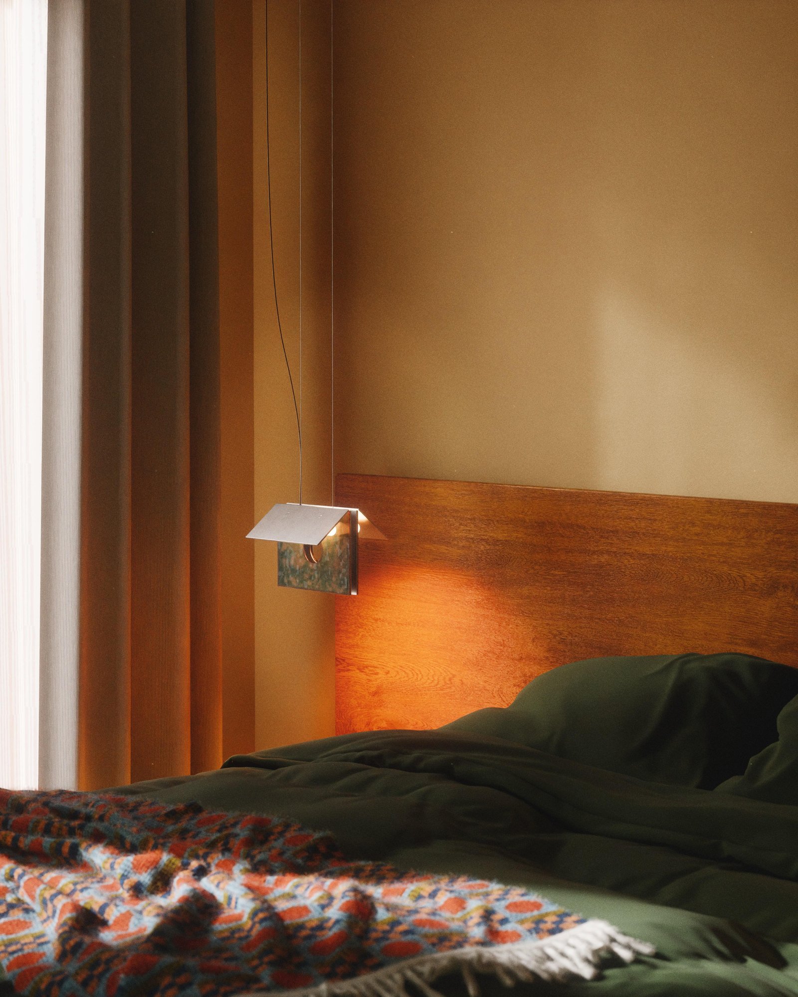 Lambert & Fils Bolda suspension lamp over bed, moody lighting.